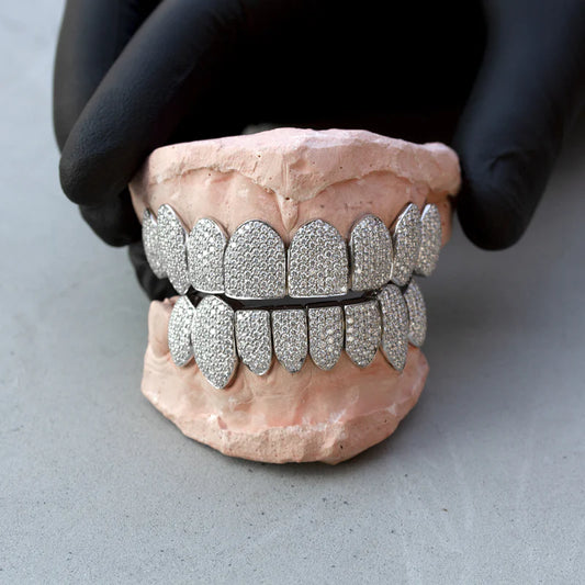 .925 silver VVS qaulity Moissanite Diamonds, per tooth (COMPLETLY BUSTDOWN) hand set