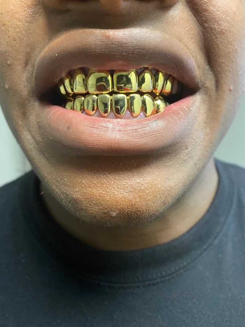 18kt gold per tooth (pullouts) Grills