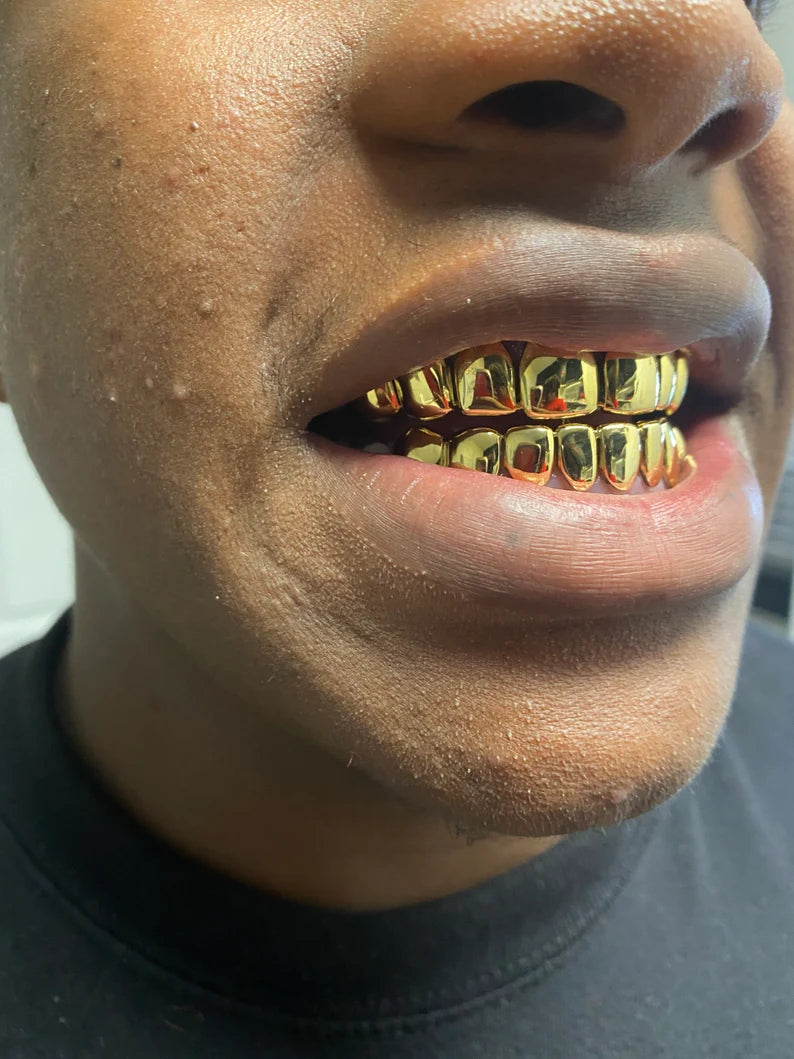 18kt gold per tooth (pullouts) Grills