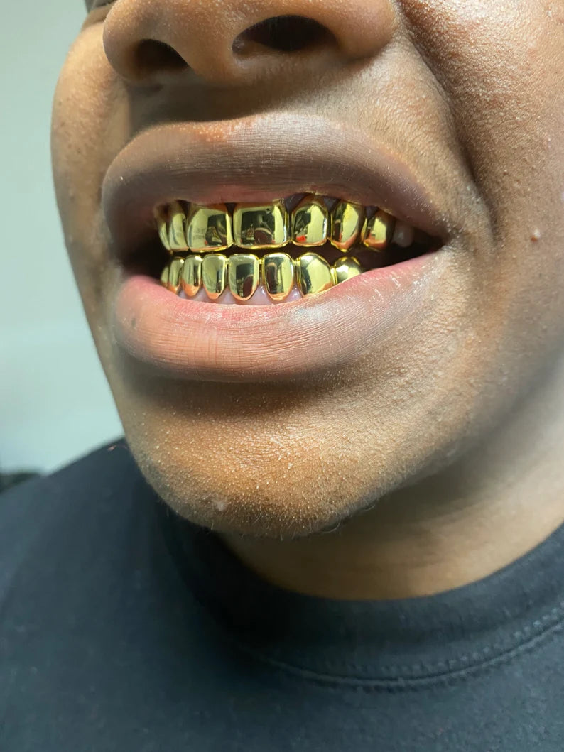 18kt gold per tooth (pullouts) Grills